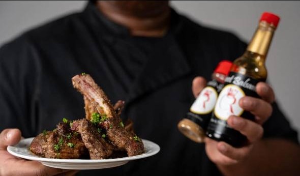Chef Red plating his signature lamb chops